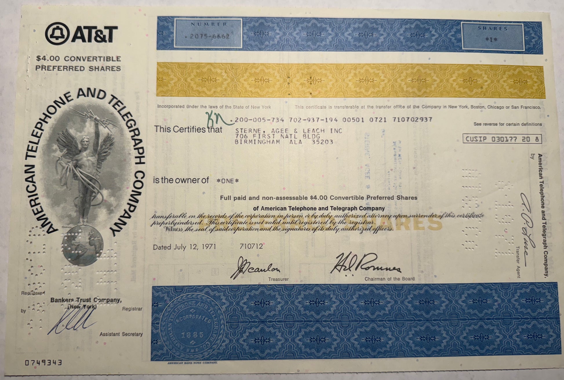 Blue and yellow ATT Stock certificate FROM 1971. Cancellation holes, writing and stamps present