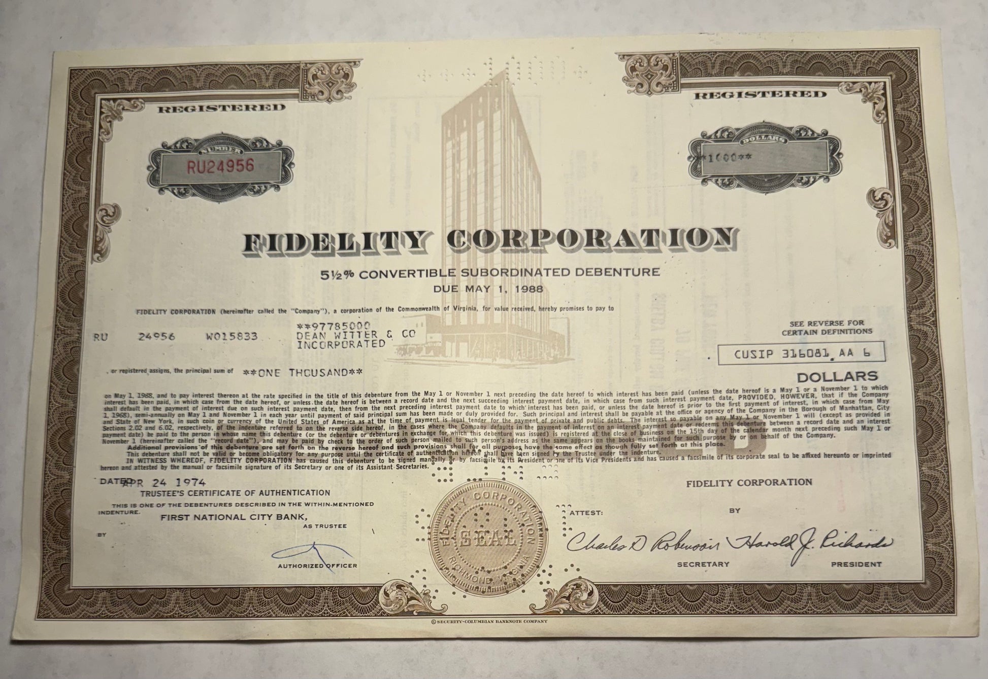 Fidelity Corporation Bond Certificate, brown w vignette of their offices. bond due may 1988. issues in 1974. cancellation holes and stamps present