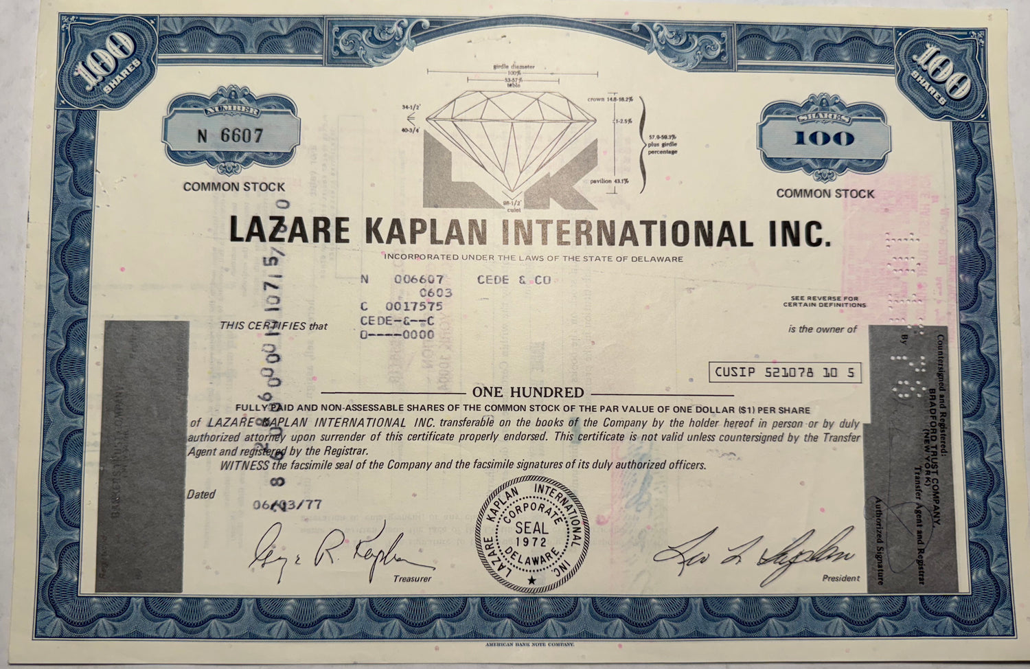  This blue stock certificate from Lazare Kaplan International (LKI), issued in 1977, features a beautiful vignette of a diamond, along with cancellation holes, stamps, and handwritten annotations, indicating its authenticity and historical use.