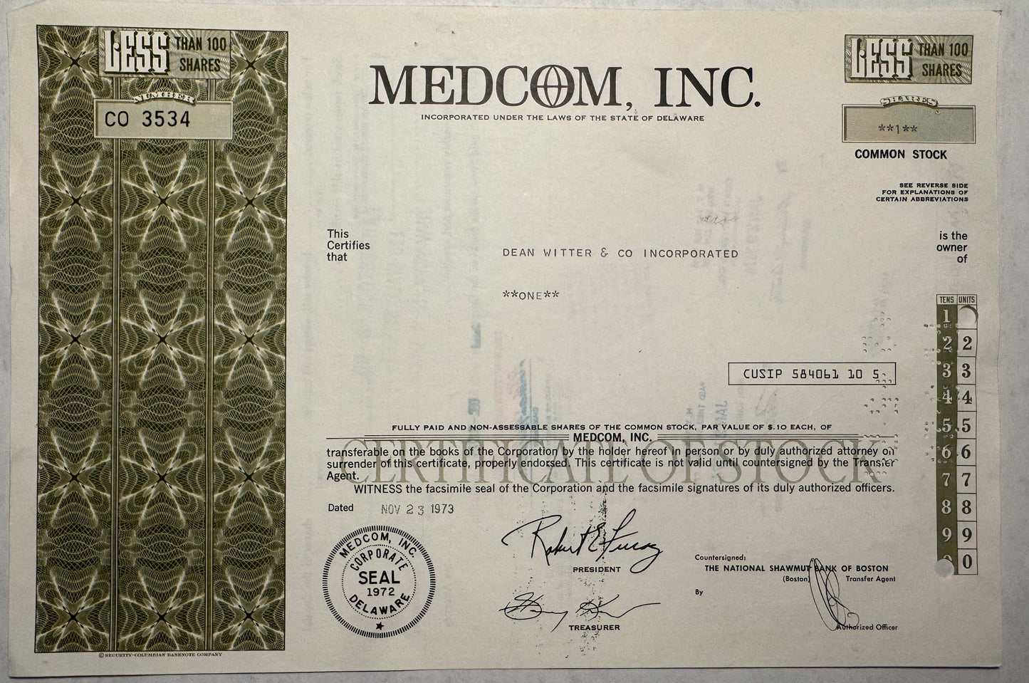 This is a green stock certificate from Medcom Incorporated, issued in 1973. It was registered in Delaware.