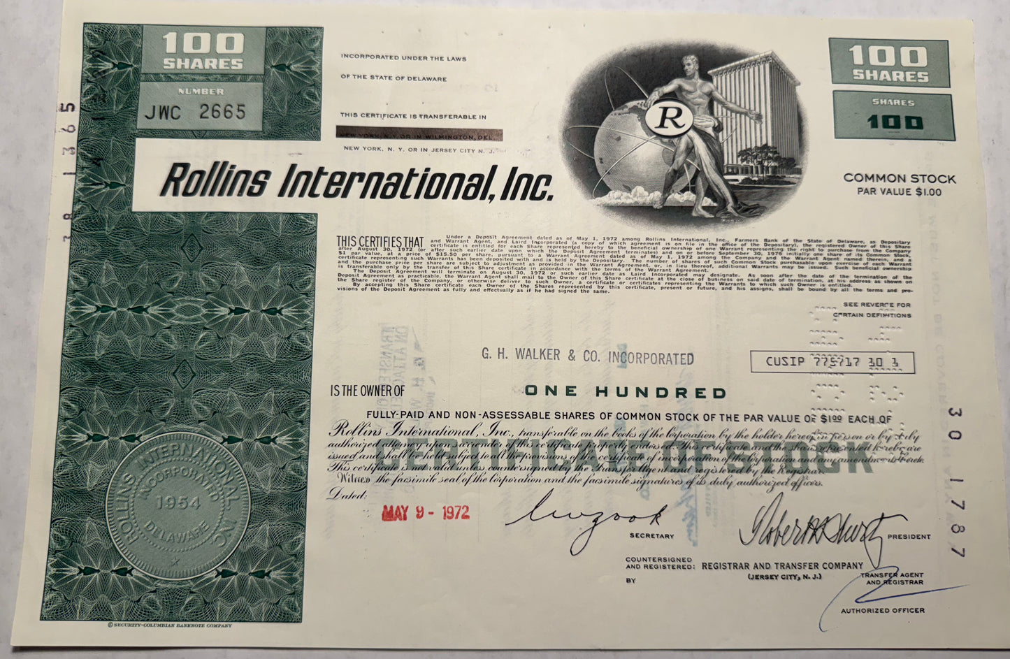 Rollins International Inc Stock Certificate, green from 1972, cancellation holes, stamps and writing on the certificate