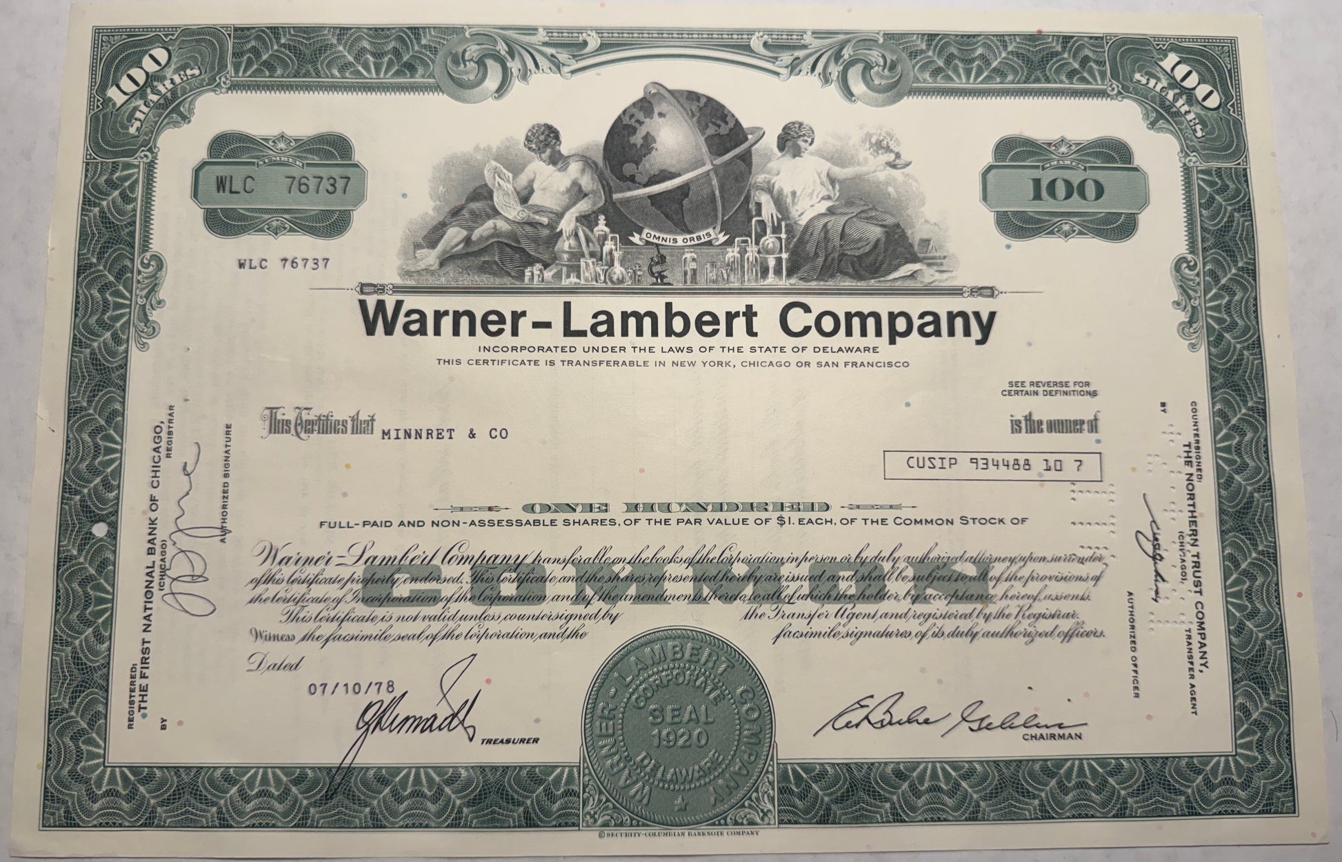 Warner-Lambert Company Stock Certificate, green from 1978, cancellation holes, stamps and writing present. 