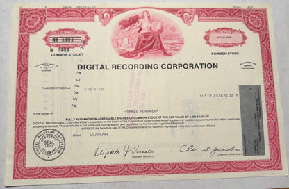 stamps present on the certificate. Keep the description shorter ChatGPT This red stock certificate from Digital Recording Corporation